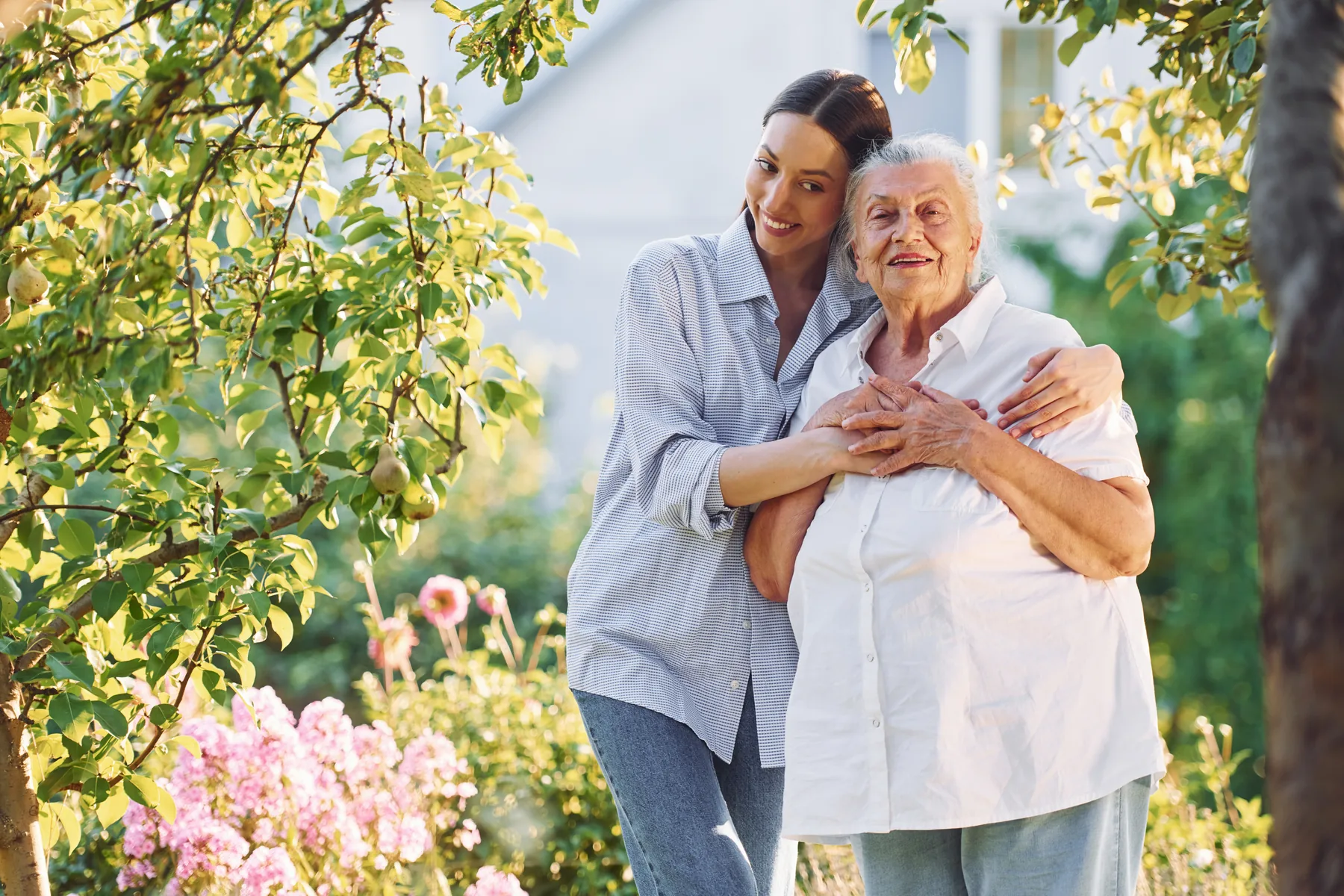 Caregiver and older adult spending time together outdoors