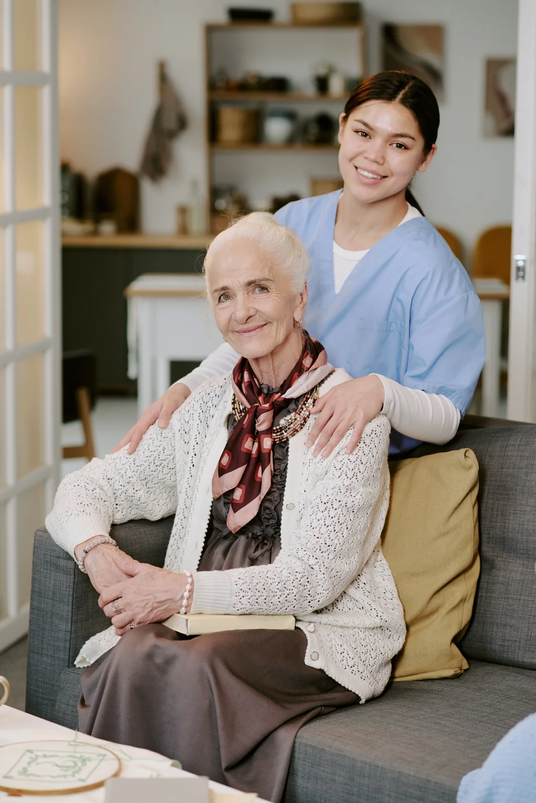 Caregiver visiting an older woman in her home